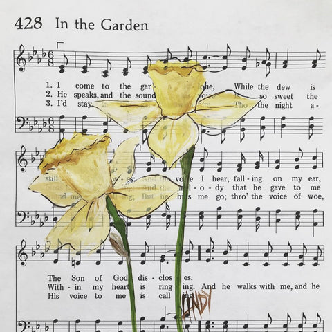Block in the garden on hymnal music sheet by Lindy Tate